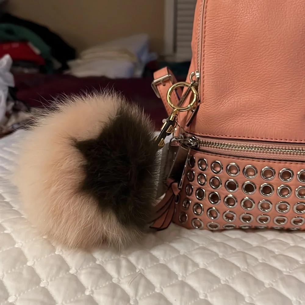 Michael Kors Rhea Medium Silver-Ringed Backpack with Fur Pompom in Coral…